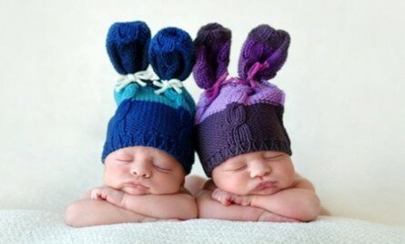 Adorable twin babies with funny hats