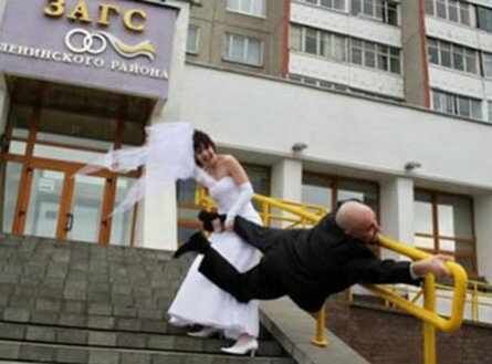 Funny Bride pulling on the Groom