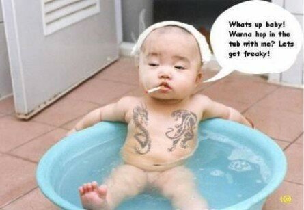 Funny looking baby in bathtub